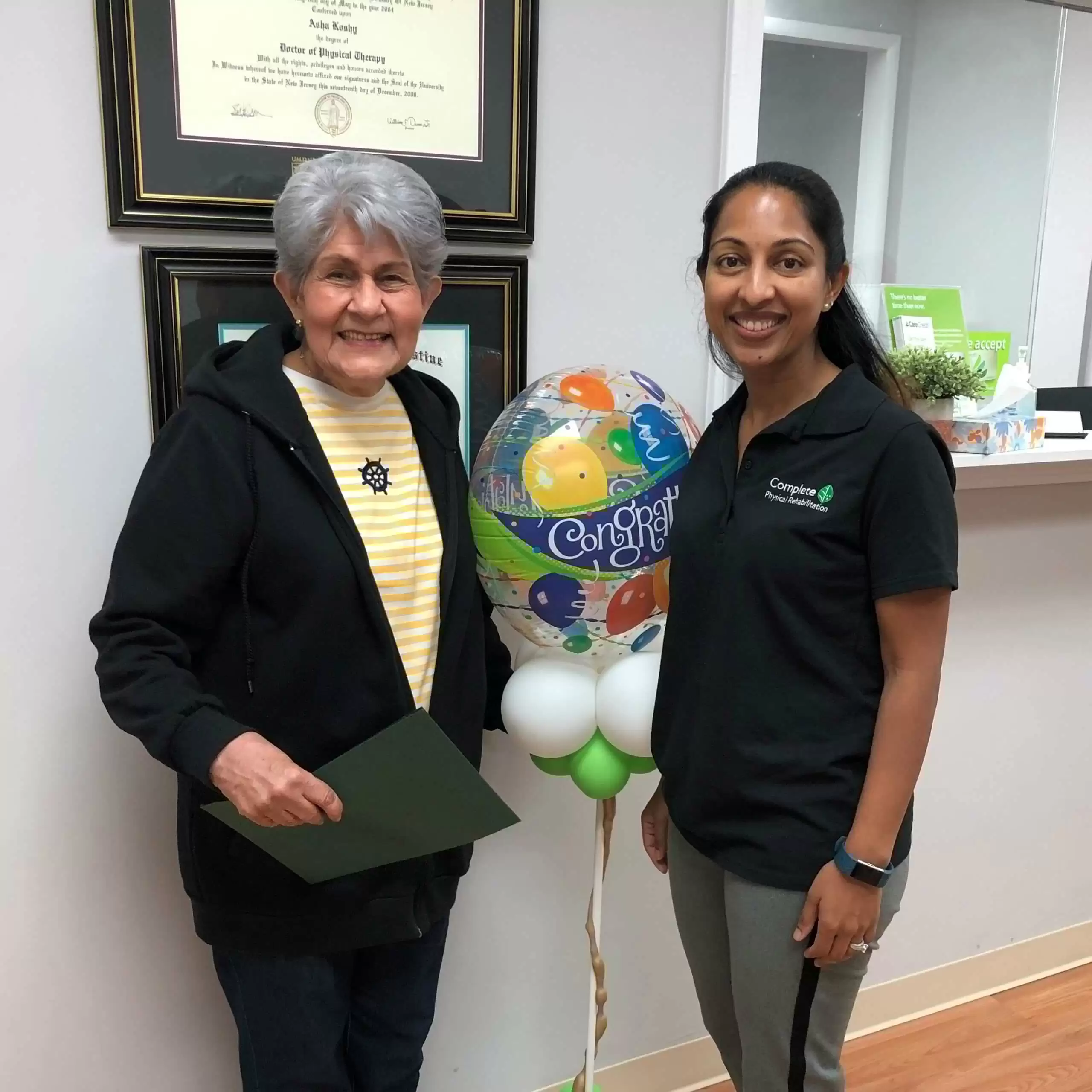 elizabeth nj physical therapy specialist Dr. Asha Koshy Pumarada with a happy Complete Physical Rehabilitation patient